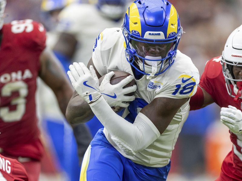 Los Angeles Rams wide receiver Tyler Johnson (18) catches a pass and runs against the Arizona Cardinals in an NFL football game, Sunday, Sept. 15, 2024, in Glendale, Ariz. (AP Photo/Jeff Lewis)