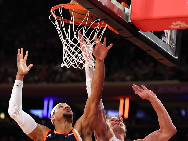 NEW YORK, NEW YORK - DECEMBER 03: Josh Hart #3 of the New York Knicks scores against Moritz Wagner #21 of the Orlando Magic during their game at Madison Square Garden on December 03, 2024 in New York City.   User expressly acknowledges and agrees that, by downloading and or using this photograph, User is consenting to the terms and conditions of the Getty Images License Agreement.  (Photo by Al Bello/Getty Images)