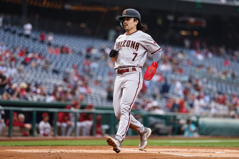 Jun 7, 2023; Washington, District of Columbia, USA; Arizona Diamondbacks left fielder Corbin Carroll (7) scores a run against the Washington Nationals during the first inning at Nationals Park. Mandatory Credit: Scott Taetsch-USA TODAY Sports