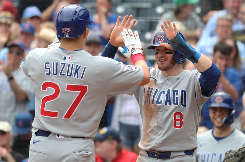 May 1, 2025; Pittsburgh, Pennsylvania, USA;  Chicago Cubs left fielder Ian Happ (8) congratulates designated hitter Seiya Suzuki (27) on his two run home run against the Pittsburgh Pirates during the seventh inning at PNC Park. Mandatory Credit: Charles LeClaire-Imagn Images
