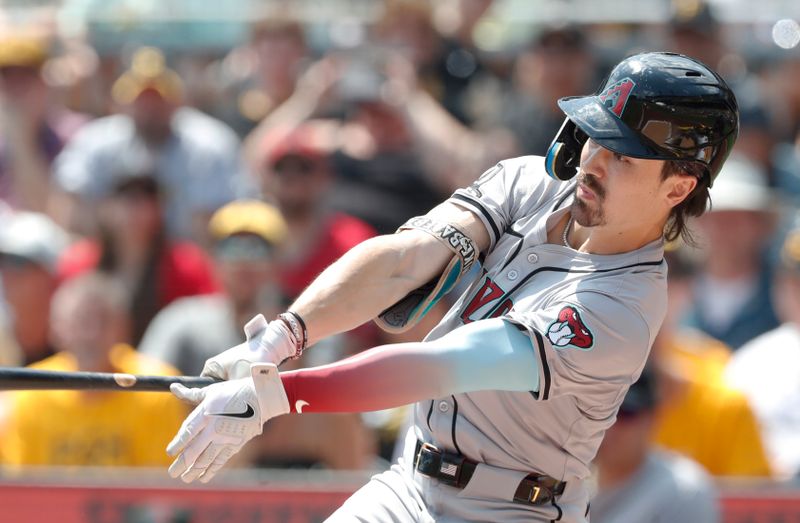 Aug 4, 2024; Pittsburgh, Pennsylvania, USA;  Arizona Diamondbacks right fielder Corbin Carroll (7) hits an infield single the Pittsburgh Pirates during the first inning against at PNC Park. Mandatory Credit: Charles LeClaire-USA TODAY Sports