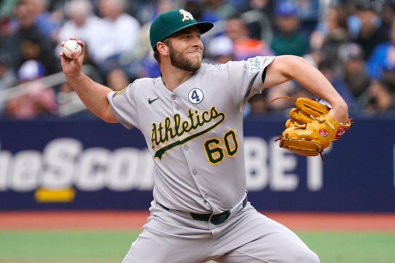Jun 1, 2025; Toronto, Ontario, CAN; Oakland Athletics pitcher Justin Sterner (60) pitches to the Toronto Blue Jays during the eighth inning at Rogers Centre. Mandatory Credit: John E. Sokolowski-Imagn Images