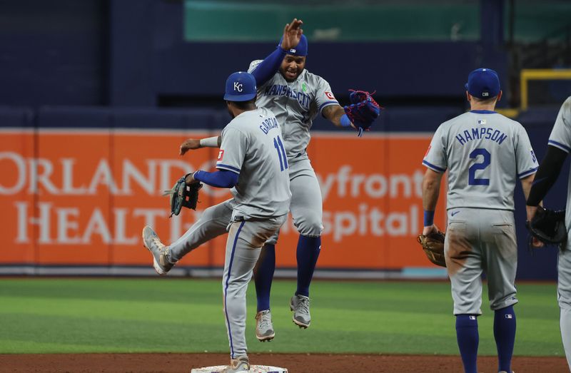 May 24, 2024; St. Petersburg, Florida, USA; Kansas City Royals third base Maikel Garcia (11), Kansas City Royals outfielder Nelson Velazquez (17) and teammates celebrate after they beat the Tampa Bay Rays at Tropicana Field. Mandatory Credit: Kim Klement Neitzel-USA TODAY Sports