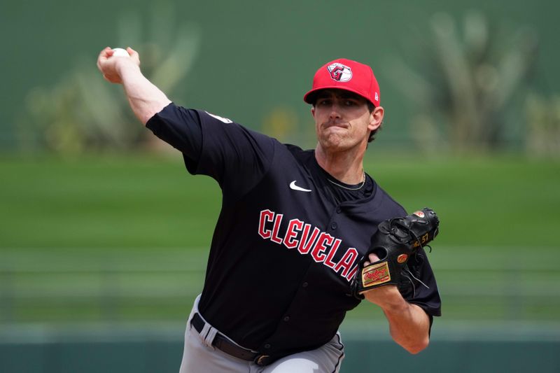Mar 12, 2024; Surprise, Arizona, USA; Cleveland Guardians starting pitcher Shane Bieber (57) pitches against the Texas Rangers during the first inning at Surprise Stadium. Mandatory Credit: Joe Camporeale-USA TODAY Sports