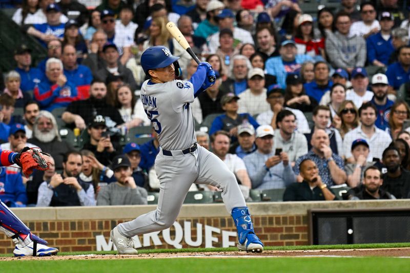 Apr 22, 2025; Chicago, Illinois, USA; Los Angeles Dodgers second base Tommy Edman (25) hits a three run home run against the Chicago Cubs during the first inning at Wrigley Field. Mandatory Credit: Matt Marton-Imagn Images