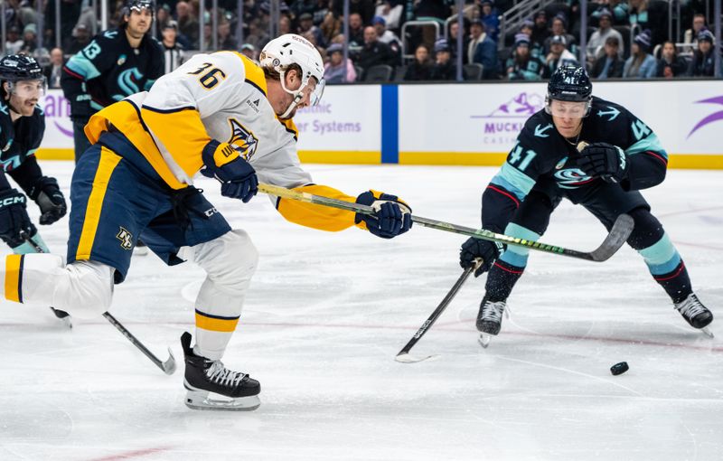 Nov 20, 2024; Seattle, Washington, USA;  Nashville Predators forward Cole Smith (36) takes a shot Seattle Kraken defenseman Ryker Evans (41) during the third period at Climate Pledge Arena. Mandatory Credit: Stephen Brashear-Imagn Images