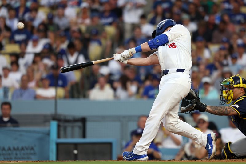 Jul 5, 2024; Los Angeles, California, USA;  Los Angeles Dodgers catcher Will Smith (16) hits a solo home run during the third inning against the Milwaukee Brewers at Dodger Stadium. Mandatory Credit: Kiyoshi Mio-USA TODAY Sports