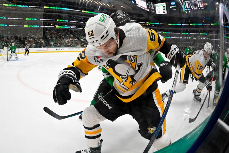 Mar 22, 2024; Dallas, Texas, USA; Pittsburgh Penguins right wing Emil Bemstrom (52) battles for control of the puck along the boards during the first period against the Dallas Stars at the American Airlines Center. Mandatory Credit: Jerome Miron-USA TODAY Sports