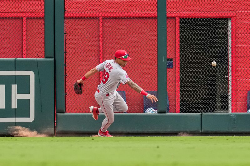 Aug 2, 2023; Cumberland, Georgia, USA; Los Angeles Angels centerfielder Jordyn Adams (39) chases a ball hit by Atlanta Braves second baseman Ozzie Albies (1) (not shown) during the eighth inning at Truist Park. Mandatory Credit: Dale Zanine-USA TODAY Sports