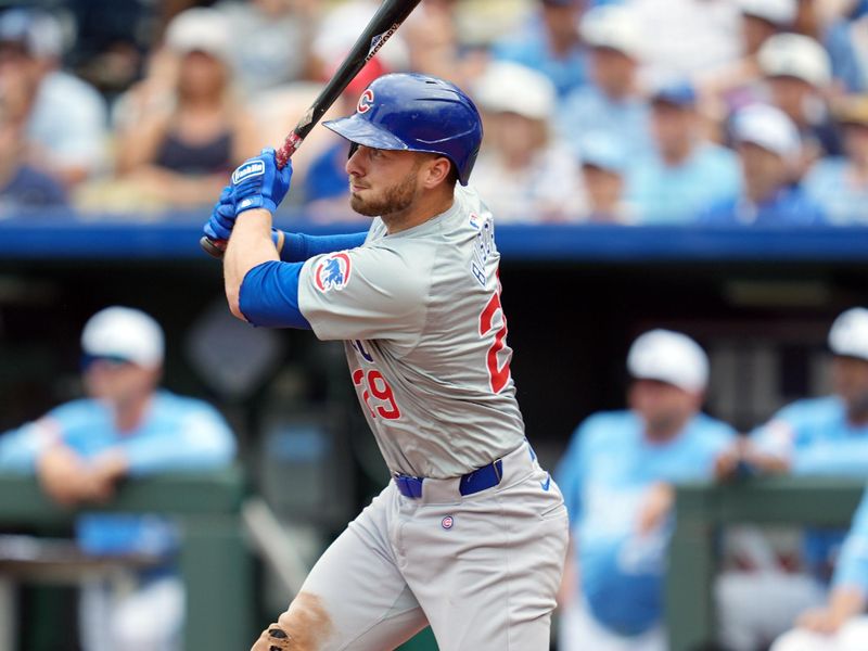 Jul 28, 2024; Kansas City, Missouri, USA; Chicago Cubs first baseman Michael Busch (29) hits an RBI single during the ninth inning against the Kansas City Royals at Kauffman Stadium. Mandatory Credit: Jay Biggerstaff-USA TODAY Sports