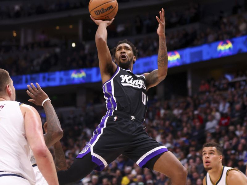 DENVER, COLORADO - FEBRUARY 28: Malik Monk #0 of the Sacramento Kings shoots the ball during the game against the Denver Nuggets at Ball Arena on February 28, 2024 in Denver, Colorado. NOTE TO USER: User expressly acknowledges and agrees that, by downloading and or using this photograph, User is consenting to the terms and conditions of the Getty Images License Agreement. (Photo by Alysa Rubin/Clarkson Creative/Getty Images)