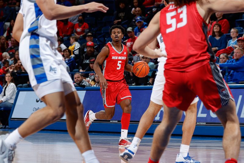 Feb 10, 2023; Colorado Springs, Colorado, USA; New Mexico Lobos guard Jamal Mashburn Jr. (5) controls the ball in the first half against the Air Force Falcons at Clune Arena. Mandatory Credit: Isaiah J. Downing-USA TODAY Sports