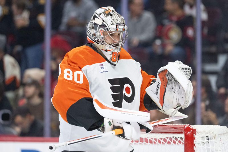 Oct 23, 2025; Ottawa, Ontario, CAN; Philadelphia Flyers goalie Dan Vladar (80) checks his equipment prior to the start of game against the Ottawa Senators at the Canadian Tire Centre. Mandatory Credit: Marc DesRosiers-IMAGN Images