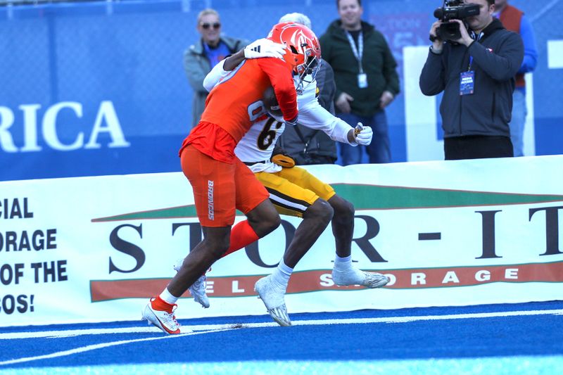 Oct 28, 2023; Boise, Idaho, USA; Boise State Broncos wide receiver Eric McAlister (80) is tackled by Wyoming Cowboys cornerback Kolbey Taylor (6) during the first half at Albertsons Stadium. Mandatory Credit: Brian Losness-USA TODAY Sports

s