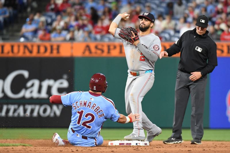 May 1, 2025; Philadelphia, Pennsylvania, USA; Washington Nationals second base Luis García Jr. (2) gets force out on  outfielder Kyle Schwarber (12) and throws to first base to complete double play during the eighth inning at Citizens Bank Park. Mandatory Credit: Eric Hartline-Imagn Images