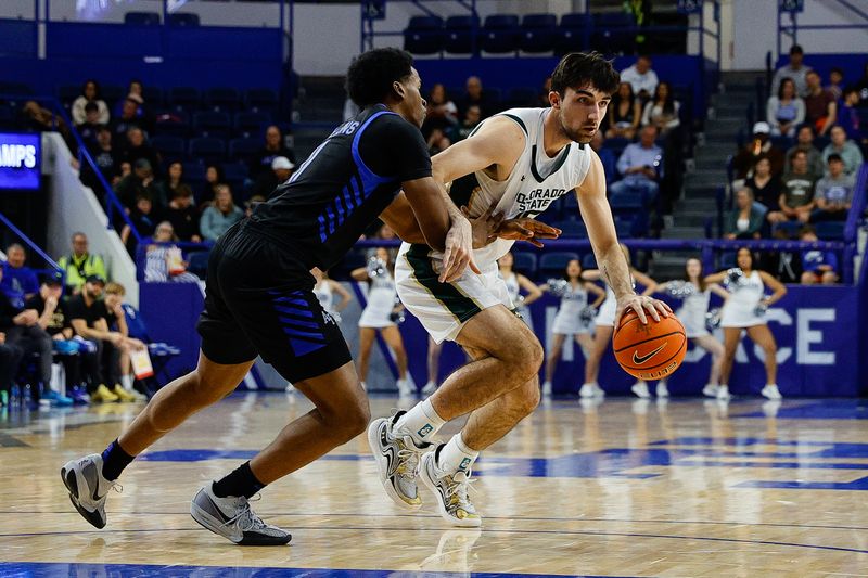 Feb 25, 2025; Colorado Springs, Colorado, USA; Colorado State Rams guard Ethan Morton (25) controls the ball against Air Force Falcons guard Byron Brown (11) in the second half at Clune Arena. Mandatory Credit: Isaiah J. Downing-Imagn Images