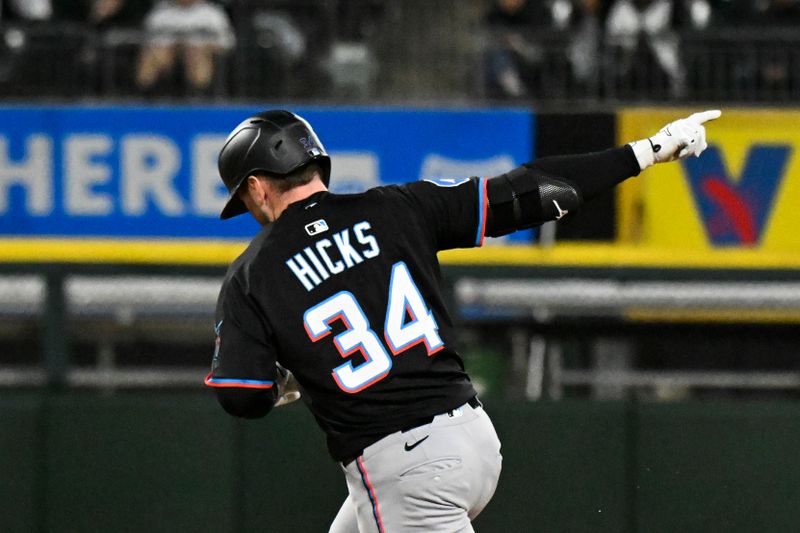 May 9, 2025; Chicago, Illinois, USA;  Miami Marlins catcher Liam Hicks (34) points after he homerun against the Chicago White Sox during the seventh inning at Rate Field. Mandatory Credit: Matt Marton-Imagn Images