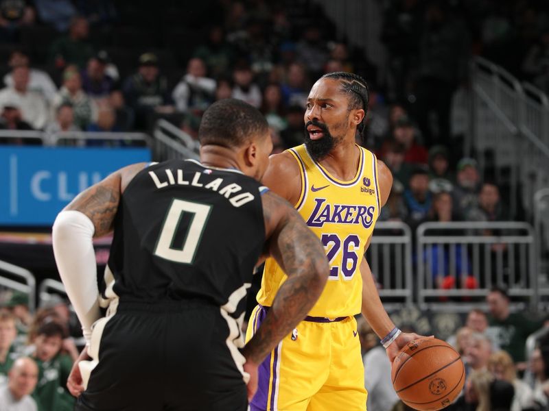 MILWAUKEE, WI - MARCH 26: Spencer Dinwiddie #26 of the Los Angeles Lakers dribbles the ball during the game against the Milwaukee Bucks on March 26, 2024 at the Fiserv Forum Center in Milwaukee, Wisconsin. NOTE TO USER: User expressly acknowledges and agrees that, by downloading and or using this Photograph, user is consenting to the terms and conditions of the Getty Images License Agreement. Mandatory Copyright Notice: Copyright 2024 NBAE (Photo by Gary Dineen/NBAE via Getty Images).