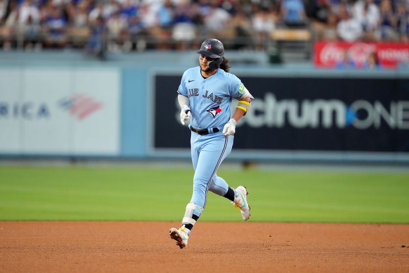 Jul 25, 2023; Los Angeles, California, USA; Toronto Blue Jays shortstop Bo Bichette (11) rounds the bases after hitting a two-run home run in the third inning against the Los Angeles Dodgers at Dodger Stadium. Mandatory Credit: Kirby Lee-USA TODAY Sports