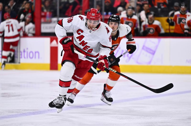 Nov 28, 2023; Philadelphia, Pennsylvania, USA; Carolina Hurricanes left wing Michael Bunting (58) chases a loose puck against the Philadelphia Flyers in the third period at Wells Fargo Center. Mandatory Credit: Kyle Ross-USA TODAY Sports