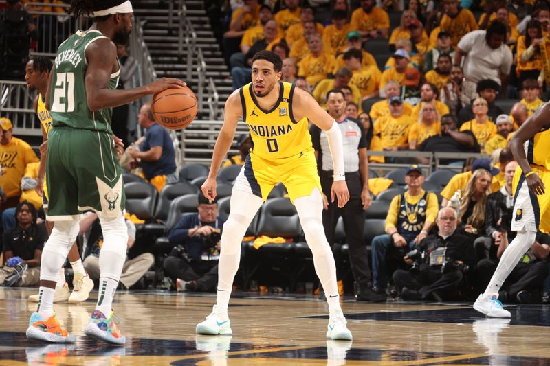 INDIANAPOLIS, IN - APRIL 26: Tyrese Haliburton #0 of the Indiana Pacers plays defense during the game against the Milwaukee Bucks during Round 1 Game 3 of the 2024 NBA Playoffs on April 26, 2024 at Gainbridge Fieldhouse in Indianapolis, Indiana. NOTE TO USER: User expressly acknowledges and agrees that, by downloading and or using this Photograph, user is consenting to the terms and conditions of the Getty Images License Agreement. Mandatory Copyright Notice: Copyright 2023 NBAE (Photo by Nathaniel S. Butler/NBAE via Getty Images)