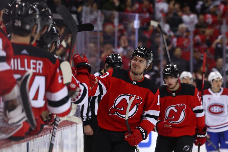 Jan 17, 2024; Newark, New Jersey, USA; New Jersey Devils right wing Alexander Holtz (10) celebrates his goal against the Montreal Canadiens during the third period at Prudential Center. Mandatory Credit: Ed Mulholland-USA TODAY Sports