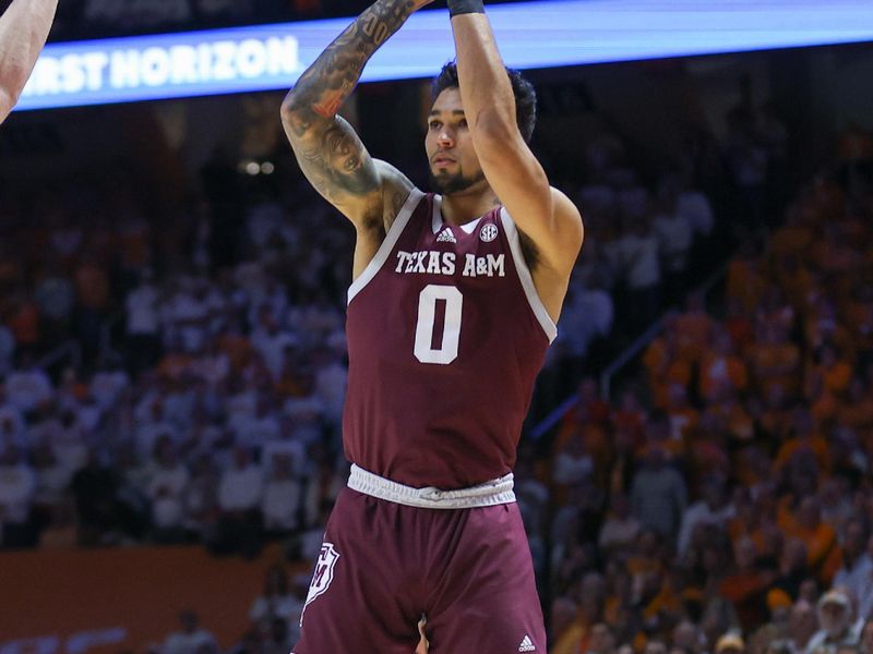 Feb 24, 2024; Knoxville, Tennessee, USA; Texas A&M Aggies guard Jace Carter (0) shoots the ball against the Tennessee Volunteers during the first half at Thompson-Boling Arena at Food City Center. Mandatory Credit: Randy Sartin-USA TODAY Sports