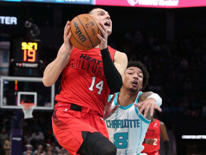 CHARLOTTE, NC - NOVEMBER 27: Tyler Herro #14 of the Miami Heat handles the ball during the game against the Charlotte Hornets on November 27, 2024 at Spectrum Center in Charlotte, North Carolina. NOTE TO USER: User expressly acknowledges and agrees that, by downloading and or using this photograph, User is consenting to the terms and conditions of the Getty Images License Agreement. Mandatory Copyright Notice: Copyright 2024 NBAE (Photo by Brock Williams-Smith/NBAE via Getty Images)