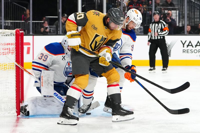 Mar 8, 2026; Las Vegas, Nevada, USA; Edmonton Oilers goaltender Connor Ingram (39) makes a save behind defenseman Jake Walman (96) and Vegas Golden Knights left wing Brandon Saad (20) during the third period at T-Mobile Arena. Mandatory Credit: Stephen R. Sylvanie-Imagn Images