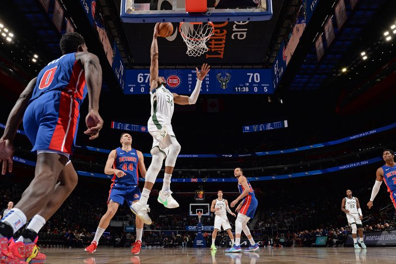 DETROIT, MI - JANUARY 20: Giannis Antetokounmpo #34 of the Milwaukee Bucks dunks the ball during the game against the Detroit Pistons on January 20, 2024 at Little Caesars Arena in Detroit, Michigan. NOTE TO USER: User expressly acknowledges and agrees that, by downloading and/or using this photograph, User is consenting to the terms and conditions of the Getty Images License Agreement. Mandatory Copyright Notice: Copyright 2024 NBAE (Photo by Chris Schwegler/NBAE via Getty Images)