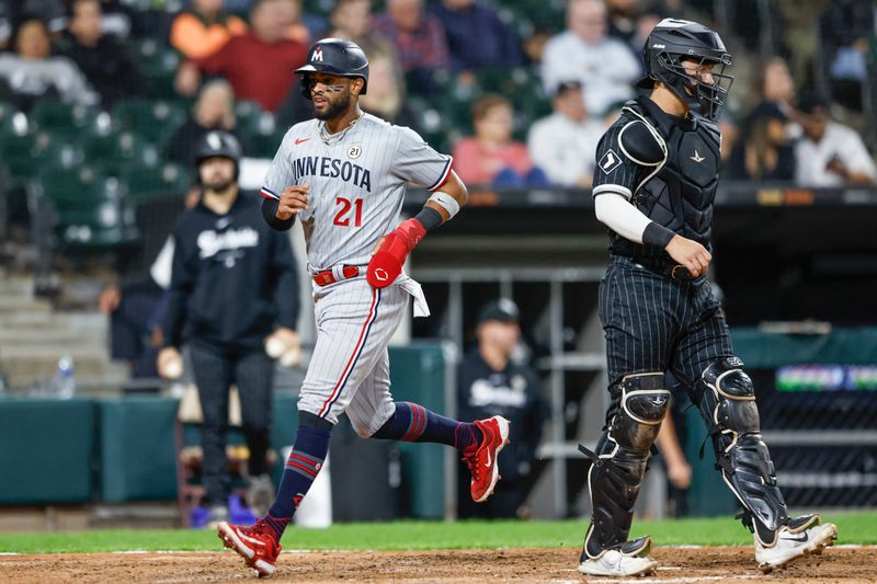 Sep 15, 2023; Chicago, Illinois, USA; Minnesota Twins left fielder Willi Castro scores against the Chicago White Sox during the ninth inning at Guaranteed Rate Field. Mandatory Credit: Kamil Krzaczynski-USA TODAY Sports