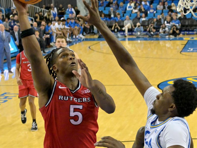 Feb 3, 2026; Los Angeles, California, USA;  Rutgers Scarlet Knights guard Darren Buchanan Jr. (5) shoots over UCLA Bruins forward Xavier Booker (1) in the second half at Pauley Pavilion presented by Wescom Financial. Mandatory Credit: Jayne Kamin-Oncea-Imagn Images