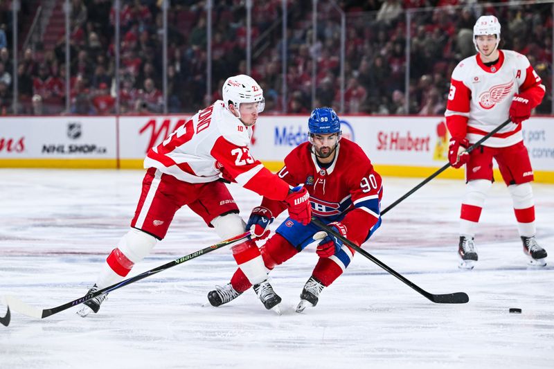 Jan 10, 2026; Montreal, Quebec, CAN; Detroit Red Wings left wing Lucas Raymond (23) plays the puck agianst Montreal Canadiens center Joseph Veleno (90) during the second period at Bell Centre. Mandatory Credit: David Kirouac-Imagn Images Jan 10, 2026; Montreal, Quebec, CAN; Detroit Red Wings left wing Lucas Raymond (23) plays the puck agianst Montreal Canadiens center Joseph Veleno (90) during the second period at Bell Centre. Mandatory Credit: David Kirouac-Imagn Images