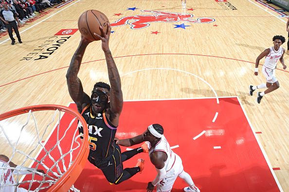 HOUSTON, TX - DECEMBER 27:   Nassir Little #25 of the Phoenix Suns drives to the basket during the game against the Houston Rockets on December 27, 2023 at the Toyota Center in Houston, Texas. NOTE TO USER: User expressly acknowledges and agrees that, by downloading and or using this photograph, User is consenting to the terms and conditions of the Getty Images License Agreement. Mandatory Copyright Notice: Copyright 2023 NBAE (Photo by Logan Riely/NBAE via Getty Images)