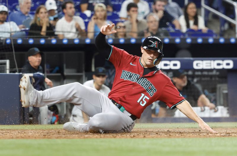 Aug 21, 2024; Miami, Florida, USA;  Arizona Diamondbacks right fielder Randal Grichuk (15) scores against the Miami Marlins in the seventh inning at loanDepot Park. Mandatory Credit: Rhona Wise-USA TODAY Sports