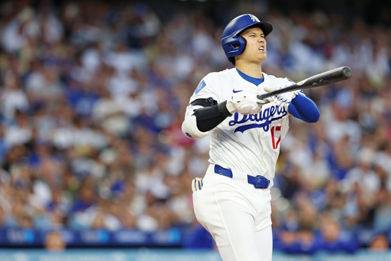 Jun 2, 2025; Los Angeles, California, USA; Los Angeles Dodgers two-way player Shohei Ohtani (17) reacts after a hit during the third inning against the New York Mets during the third inning against the New York Mets at Dodger Stadium. Mandatory Credit: Jason Parkhurst-Imagn Images