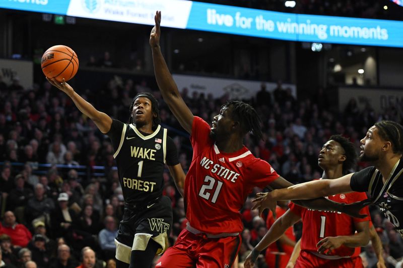 Jan 28, 2023; Winston-Salem, North Carolina, USA;   Wake Forest Demon Deacons guard Tyree Appleby (1) shoots a runner past North Carolina State Wolfpack forward Ebenezer Dowuona (21) during the first half at Lawrence Joel Veterans Memorial Coliseum. Mandatory Credit: William Howard-USA TODAY Sports