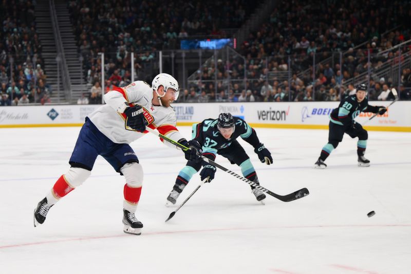 Dec 12, 2023; Seattle, Washington, USA; Florida Panthers center Sam Bennett (9) shoots the puck against the Seattle Kraken during the first period at Climate Pledge Arena. Mandatory Credit: Steven Bisig-USA TODAY Sports