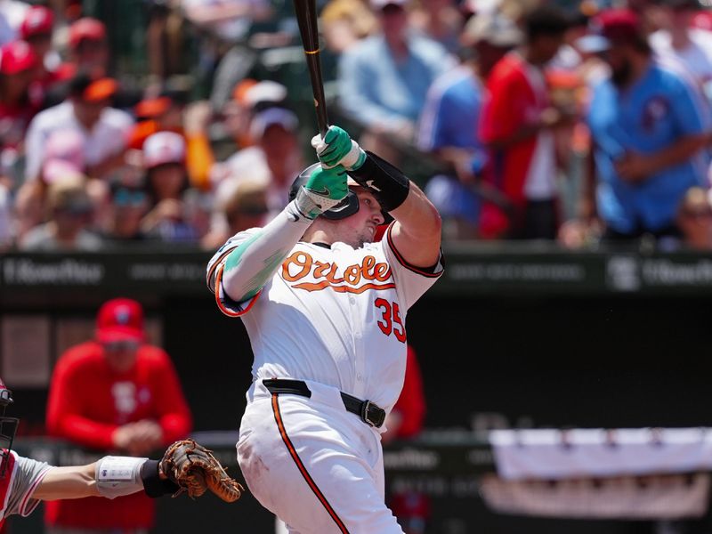 Jun 16, 2024; Baltimore, Maryland, USA; Baltimore Orioles catcher Adley Rutschman (35) hits a home run against the Philadelphia Phillies during the third inning at Oriole Park at Camden Yards. Mandatory Credit: Gregory Fisher-USA TODAY Sports