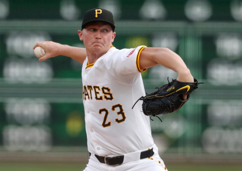 Aug 26, 2024; Pittsburgh, Pennsylvania, USA;  Pittsburgh Pirates starting pitcher Mitch Keller (23) delivers a pitch against the Chicago Cubs during the first inning at PNC Park. Mandatory Credit: Charles LeClaire-USA TODAY Sports