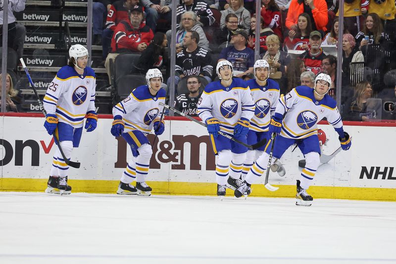 Oct 27, 2023; Newark, New Jersey, USA; Buffalo Sabres right wing JJ Peterka (77) celebrates his goal with teammates during the first period against the New Jersey Devils at Prudential Center. Mandatory Credit: Vincent Carchietta-USA TODAY Sports