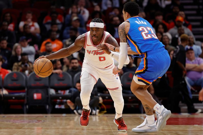 HOUSTON, TEXAS - DECEMBER 06: Aaron Holiday #0 of the Houston Rockets drives against Tre Mann #23 of the Oklahoma City Thunder during the second half at Toyota Center on December 06, 2023 in Houston, Texas. NOTE TO USER: User expressly acknowledges and agrees that, by downloading and or using this photograph, User is consenting to the terms and conditions of the Getty Images License Agreement.? (Photo by Carmen Mandato/Getty Images)