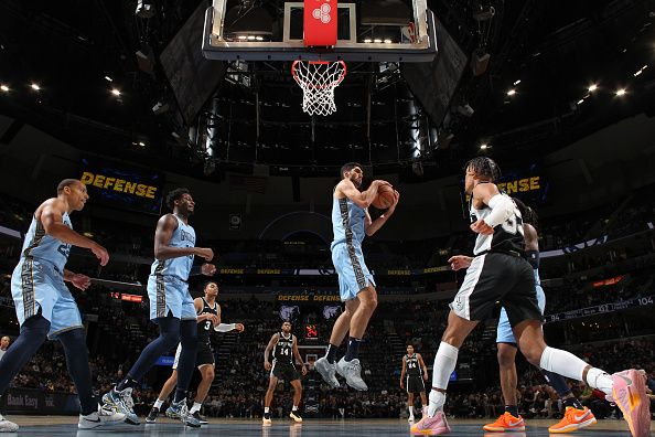 MEMPHIS, TN - JANUARY 2:  Santi Aldama #7 of the Memphis Grizzlies grabs the rebound during the game  on January 2, 2024 at FedExForum in Memphis, Tennessee. NOTE TO USER: User expressly acknowledges and agrees that, by downloading and or using this photograph, User is consenting to the terms and conditions of the Getty Images License Agreement. Mandatory Copyright Notice: Copyright 2024 NBAE (Photo by Joe Murphy/NBAE via Getty Images)