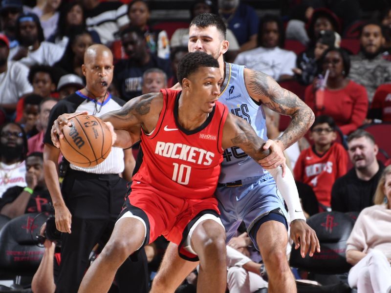 HOUSTON, TX - OCTOBER 25: Jabari Smith Jr. #10 of the Houston Rockets dribbles the ball during the game against the Memphis Grizzlies on October 25, 2024 at the Toyota Center in Houston, Texas. NOTE TO USER: User expressly acknowledges and agrees that, by downloading and or using this photograph, User is consenting to the terms and conditions of the Getty Images License Agreement. Mandatory Copyright Notice: Copyright 2024 NBAE (Photo by Logan Riely/NBAE via Getty Images)