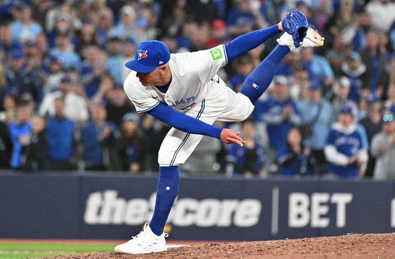 Apr 8, 2024; Toronto, Ontario, CAN; Toronto Blue Jays relief pitcher Chad Green (57) delivers a pitch against the Seattle Mariners in the ninth inning at Rogers Centre. Mandatory Credit: Dan Hamilton-USA TODAY Sports