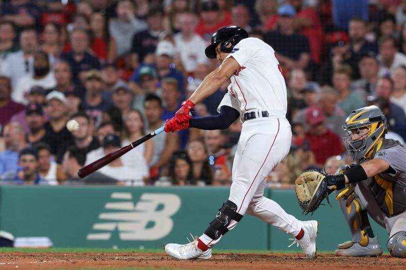 Jul 10, 2024; Boston, Massachusetts, USA; Boston Red Sox left fielder Rob Refsnyder (30) hits a solo home run during the sixth inning against the Oakland Athletics at Fenway Park. Mandatory Credit: Paul Rutherford-USA TODAY Sports