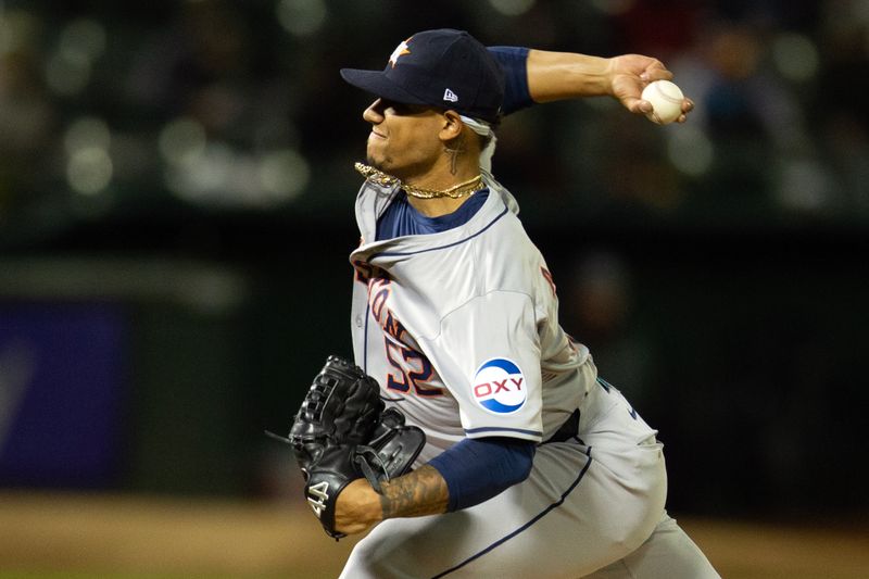 May 24, 2024; Oakland, California, USA; Houston Astros pitcher Bryan Abreu (52) delivers a pitch against the Oakland Athletics during the seventh inning at Oakland-Alameda County Coliseum. Mandatory Credit: D. Ross Cameron-USA TODAY Sports