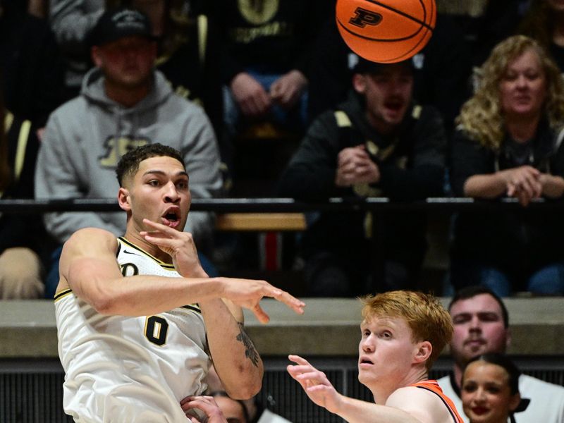 Jan 5, 2024; West Lafayette, Indiana, USA; Purdue Boilermakers forward Mason Gillis (0) passes the ball away from Illinois Fighting Illini guard Luke Goode (10) during the first half at Mackey Arena. Mandatory Credit: Marc Lebryk-USA TODAY Sports