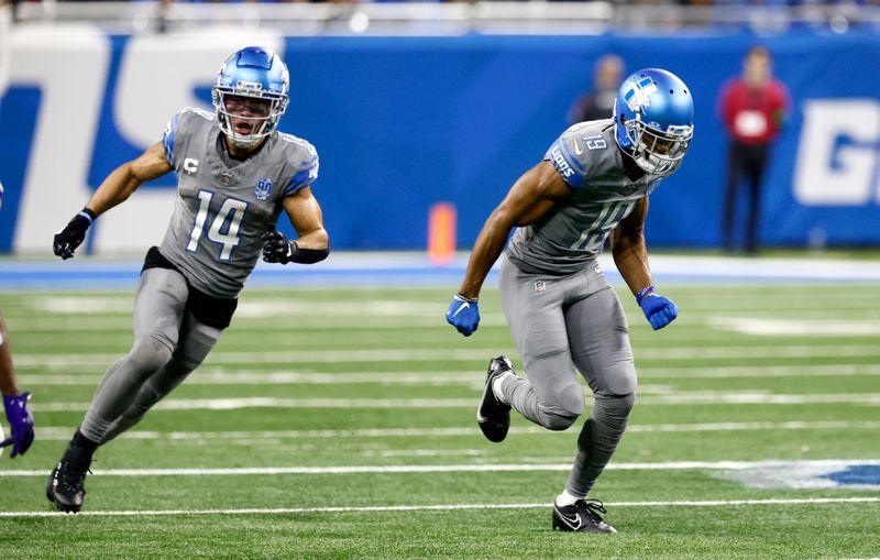 Detroit Lions wide receiver Amon-Ra St. Brown (14) and wide receiver Donovan Peoples-Jones (19) break down the field against the Minnesota Vikings during the second half of an NFL football game Sunday, Jan. 7, 2024, in Detroit. (AP Photo/Duane Burleson)