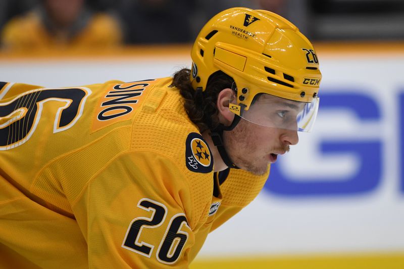 Dec 19, 2023; Nashville, Tennessee, USA; Nashville Predators center Philip Tomasino (26) waits for a face off during the first period against the Vancouver Canucks at Bridgestone Arena. Mandatory Credit: Christopher Hanewinckel-USA TODAY Sports